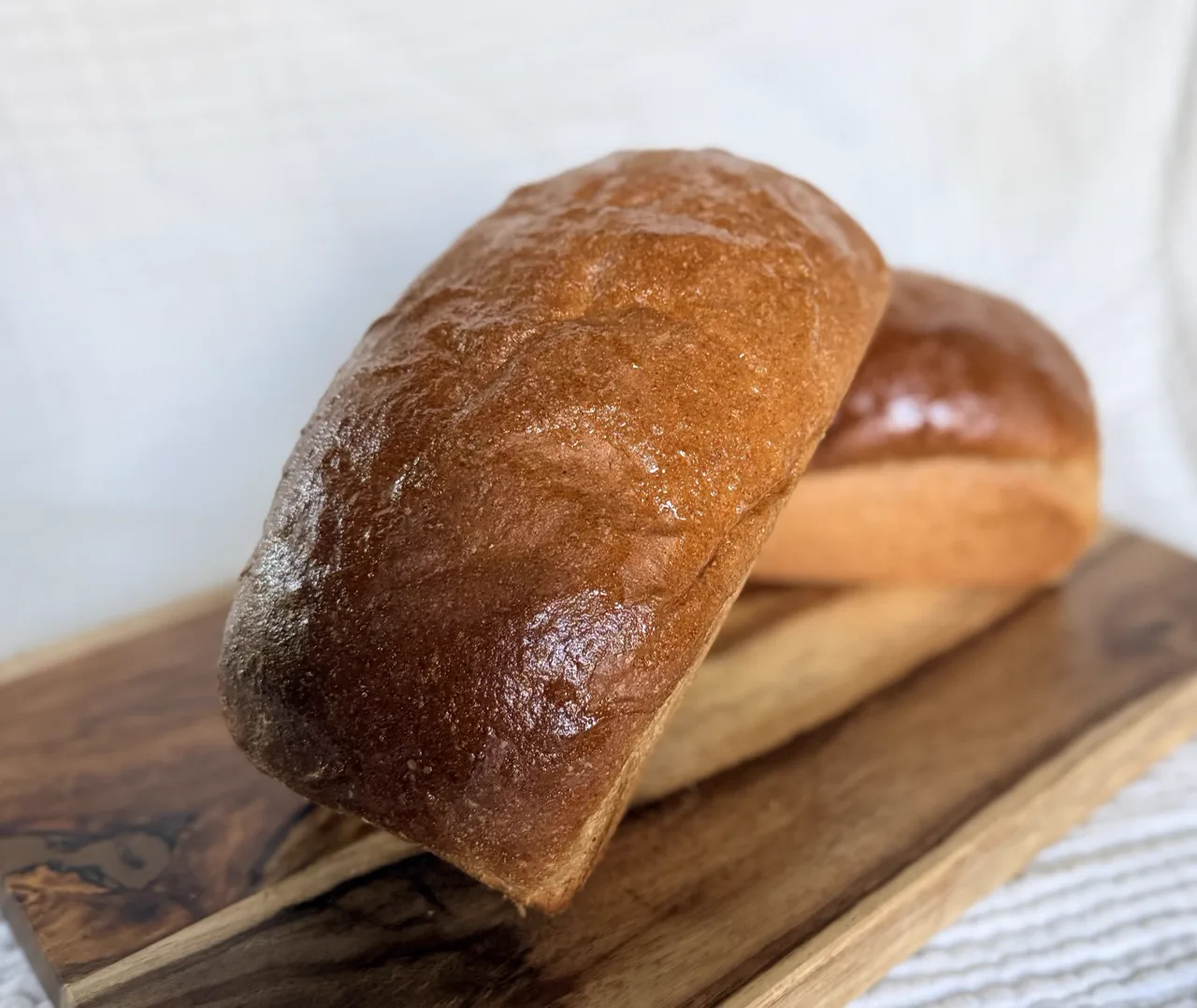 A baked loaf on a cutting board